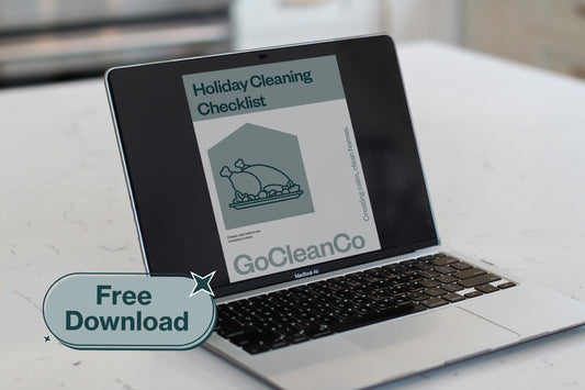 Laptop displaying a holiday cleaning checklist from GoCleanCo on a white surface.