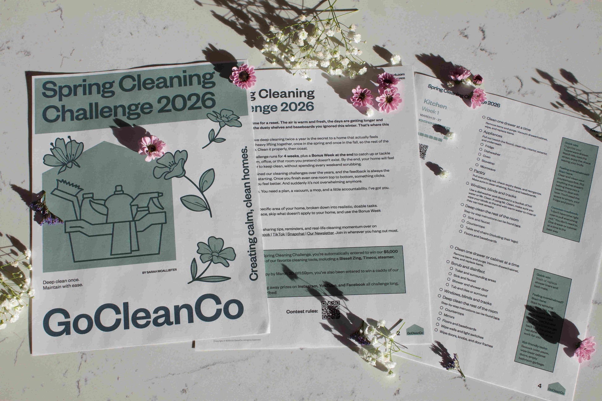 Spring Cleaning Challenge 2026 with floral decorations on a white surface