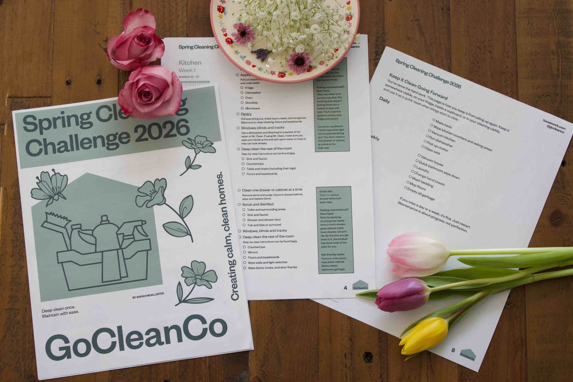 GoCleanCo Spring Cleaning Challenge 2026 flyer on a wooden surface with flowers.