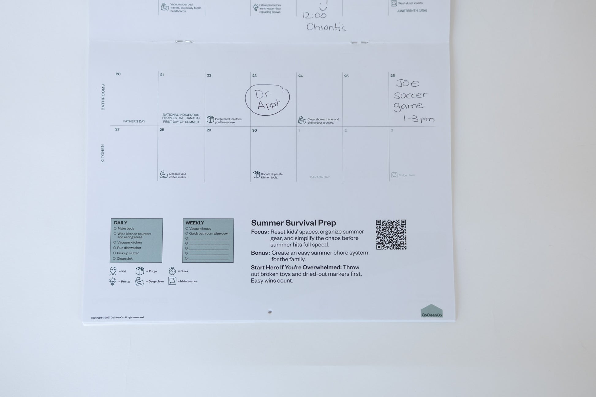 A white calendar page with handwritten notes and sections for daily and weekly cleaning, photographed against a plain white background.