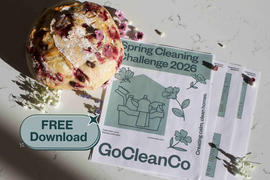 GoCleanCo spring cleaning challenge pdf with a bread loaf and flowers on a light surface